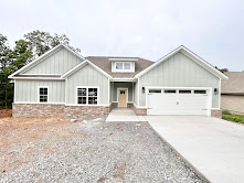 New construction on a flat .31 acre wooded lot! Easy access to I-49, Lake Loch Lomond boat launch, and Highlands Golf Course! Step inside to discover an inviting open concept design featuring beautiful floors that enhance the spacious feel of the home. NO CARPET! Two bedroom plus office. The stylish kitchen is equipped with a gas range, premium black stainless steel appliances, 3 cm quartz countertops, custom cabinets, and a walk-in pantry. Entertain or unwind in the living area, complete with a stunning fireplace, or step out onto the huge back covered deck to enjoy the peaceful surroundings. The primary suite features a large walk-in tile shower! Buyer can receive $3,500 in closing costs when using the builder's preferred lender!