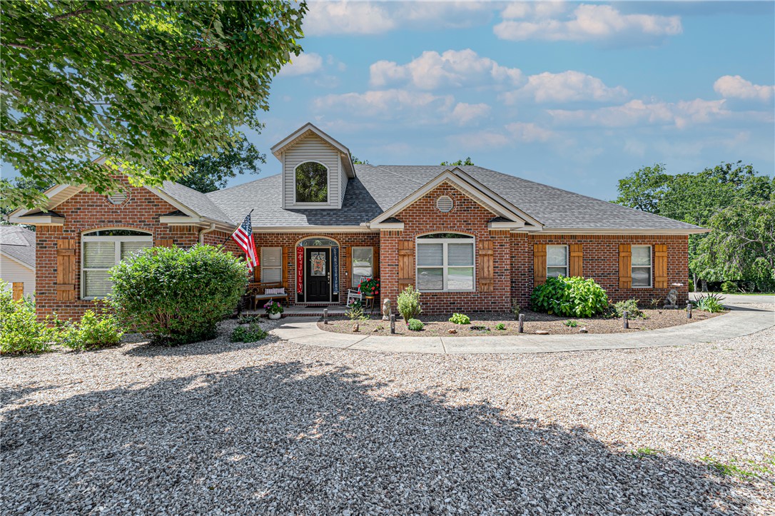 Here's the updated version:
We just have to tell you about this one — 73 Eddleston Dr in Bella Vista! If you've been dreaming of lake life without giving up neighborhood conveniences, this is it. This 3-bedroom, 2-bath ranch has such a warm, welcoming feel the moment you pull up, and wait until you see the sunroom — it looks right out over the woods and Lake Loch Lomond, perfect for morning coffee or unwinding after a long day. The living room's cathedral ceiling and cozy gas fireplace make it feel so much bigger than 2,232 square feet, and the granite counters and walk-in closets are just the kind of everyday touches that make a house feel like home. Plus, you're getting all the perks of Bella Vista's POA — boat docks, pool, clubhouse, tennis, trails, the works. Whether you're into biking, boating, or just want a peaceful lake view, this neighborhood has it covered. Homes like this in Eddleston don't come up often — you'll want to see it in person!