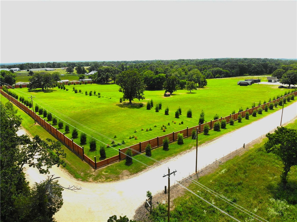 30 Acres | Exit 100 | I-49 Development Opportunity


Exceptional 30 acre development tract in the heart of Northwest Arkansas! Located at Exit 100 on I-49 and adjacent to the new Arkansas Welcome Center, this property offers approximately 2,780 feet of road frontage on two sides and is just 235 feet from the interstate. Features include two scenic ponds, mature trees, established privacy screening (via trees and impressive fencing), and a beautiful mix of level ground and rolling terrain. With a 96 site RV Park already approved through the City of Gravette, this property is primed for development. Conveniently located just 18 minutes from the Walmart Home Office. Rare opportunity to develop a highly visible property in one of the fastest-growing areas of Northwest Arkansas.
