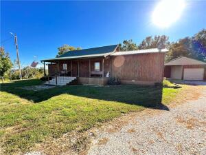 Don't wait to see this country home on 5 useable acres. Property boasts a fabulous view and bonus amenities. Outdoors you find a small pond, an established orchard, and nice garden area. A chicken coop and outdoor run are ready for your flock. The enclosed garage with dual carports provide parking, storage, and room for projects. Inside you find 1br/1ba with additional loft space. Well maintained open areas feel rustic and inviting. Screened in porch and deck spaces are ideal to take in the surroundings. Out of town location yet convenient to Hwy 74. Easy drive to Huntsville, Elkins, Fayetteville areas. Experience big country living in an ideal, manageable size.