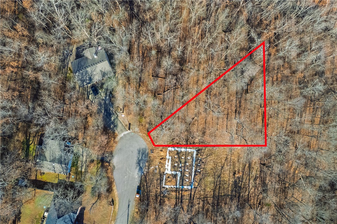 Take advantage of this 0.50-acre buildable lot in Bella Vista’s established Derby Subdivision. Located on Marlin Ln, the property offers a desirable balance of privacy and accessibility. Residents enjoy access to golf courses, lakes, parks, and community recreation centers throughout Bella Vista Village. The lot is located near the epic Bella Vista mountain biking trails, adding strong appeal for outdoor-focused buyers. Walking and biking paths are nearby, enhancing the area’s lifestyle value. Convenient access to Bentonville and the Walmart Home Office adds to the long-term investment potential.