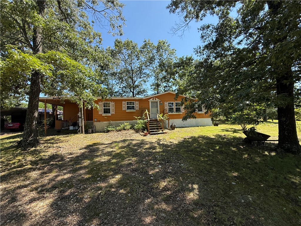 Three-bed, two-bath manufactured home on a little over 1 acre. This property includes two detached, 2-car carports, one of which includes storage. A small fenced-in area at the back of the house. It has central heat & air with the option of propane for winter heat. With room on either corner of the property to add a small or large shop, don't miss the opportunity for a slice of country living that you didn't know you needed! Schedule your showing today before it's gone!