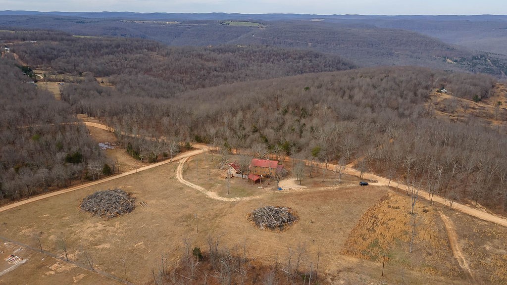 Discover this beautifully remodeled home and guest house nestled near scenic Boxley Valley and the Upper Buffalo area. Just 2 miles from the Ozark National Forest and Buffalo National River Park lands, this property offers over 9.6 open acres with mountain views. The spacious 2,800+ sq ft main home features 5 bedrooms, 3.5 baths, and an unfinished basement perfect for a media or game room. The charming guest house includes an open living and kitchen area, plus a loft that accommodates two beds. Recent updates include mini-split heating and cooling systems and a new deck. Enjoy endless outdoor adventure with nearby hiking, biking, floating, and horseback riding trails—all right at your doorstep. The property is near numerous hiking trails, mountain biking, and floating the upper district of the Buffalo. Ozark National forest is 2 miles south for bountiful hunting opportunities as well as Buffalo River Park service lands abou 2 mile as well. Shiloh Mountain is a peaceful community with absolutely wonderful views.