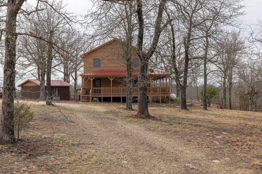 Discover this beautifully remodeled home and guest house nestled near scenic Boxley Valley and the Upper Buffalo area. Just 2 miles from the Ozark National Forest and Buffalo National River Park lands, this property offers over 9.6 open acres with mountain views. The spacious 2,800+ sq ft main home features 5 bedrooms, 3.5 baths, and an unfinished basement perfect for a media or game room. The charming guest house includes an open living and kitchen area, plus a loft that accommodates two beds. Recent updates include mini-split heating and cooling systems and a new deck. Enjoy endless outdoor adventure with nearby hiking, biking, floating, and horseback riding trails—all right at your doorstep. The property is near numerous hiking trails, mountain biking, and floating the upper district of the Buffalo. Ozark National forest is 2 miles south for bountiful hunting opportunities as well as Buffalo River Park service lands abou 2 mile as well. Shiloh Mountain is a peaceful community with absolutely wonderful views.
