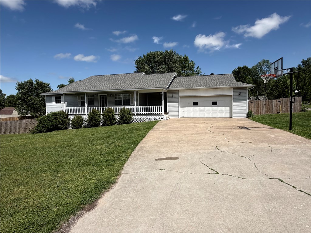 Exceptionally well maintained 3 bed, 2 bath home with a finished walk out basement on over a half acre lot in an established quiet Pea Ridge neighborhood! Upstairs has 3 bedrooms and 2 full baths with granite countertops. Real hardwood floors through main living area and master bedroom. Downstairs includes a large open area and one separate (non-conforming) bedroom/office etc. along with large storage areas. Enjoy outdoor living on the large deck which also has garden/planter boxes in the big back yard which has 2 large storage buildings, 10x16 and 12x20, chicken coop, mature trees and a play set. New privacy Fencing in 2024. New shingles in 2022.