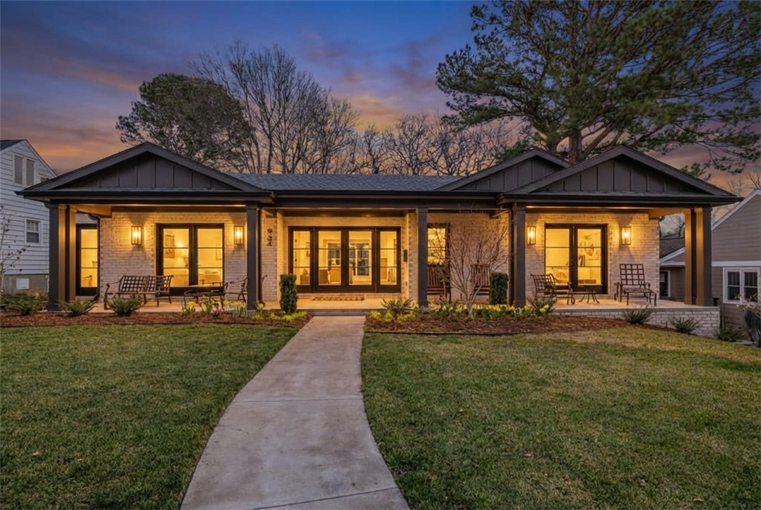 Nestled in one of Fayetteville’s most established neighborhoods, mere steps from Wilson Park, this exceptional residence artfully blends timeless elegance with sophisticated modern design. Completed in June 2024 by L&F Construction, the home was fully remodeled and thoughtfully expanded, showcasing designer finishes of the highest caliber, including 6” white oak floors, vaulted ceilings, and a chef’s kitchen perfectly suited for both everyday living and entertaining on any scale. Three expansive bedrooms, each with an en-suite bath, two beautifully appointed living areas, a spacious laundry, and bonus space in the 915 SF lower level provide unparalleled comfort and flexibility. A welcoming front porch sets a gracious tone, while just off the living room, a private terrace creates an intimate and inviting outdoor retreat for dining and relaxation. An additional 357 SF of heated usable area is not counted in square footage but an obvious bonus on the lower level.