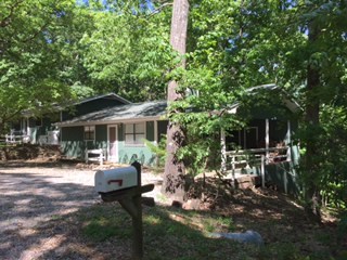 4BD/BA on 1.5 acres, very private, wood view in back, enclosed sun room, 2 wood burning fireplaces, Central H/A, 2 carports.