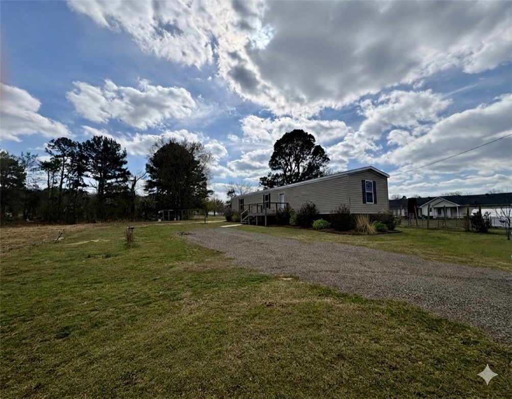 Enjoy peaceful country living just minutes from town! This newer single-wide home sits on 1.4 acres, offering the perfect blend of privacy and convenience. The property provides plenty of space for outdoor activities, gardening, animals, or future improvements. Inside, you'll find a well maintained, move in ready home with a functional layout designed for comfortable living. Whether you're looking for your first home, a downsizing opportunity, or an investment property, this one checks all the boxes. Don't miss your chance to own affordable land and a home in a quiet rural setting!
