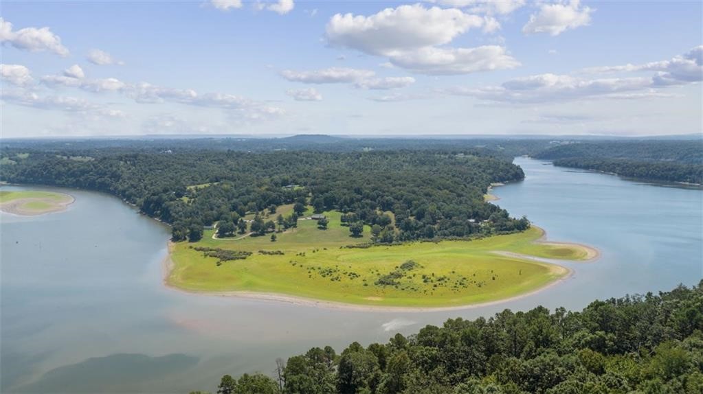 Peaceful. Private. Gorgeous bluff views that will take your breath away the first time you drive down the private road leading up to the property. Two modest well built homes; both with lake front panoramic views. Around 11 acres of the land is untouched forest with families of deer. The owner is retiring and selling the land that belonged to his dad before him. It is well cared for, loved and respected. Enjoy the lake lifestyle with your family complete with a new boat dock with two slips.