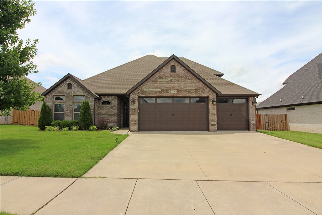 A gorgeous 4 bedroom, 3 bath, 3 car garage home located in Creekside subdivision with Pool and Playground. All the bells and whistles with this home. Granite counters, hard wood floors, split floor plan, large open kitchen with wet bar, covered patio, & outdoor gas fireplace to enjoy some outside time. 4th bedroom upstairs/ or could be BONUS room with full bath. Large fenced yard for privacy. A must see! Small pets negotiable.