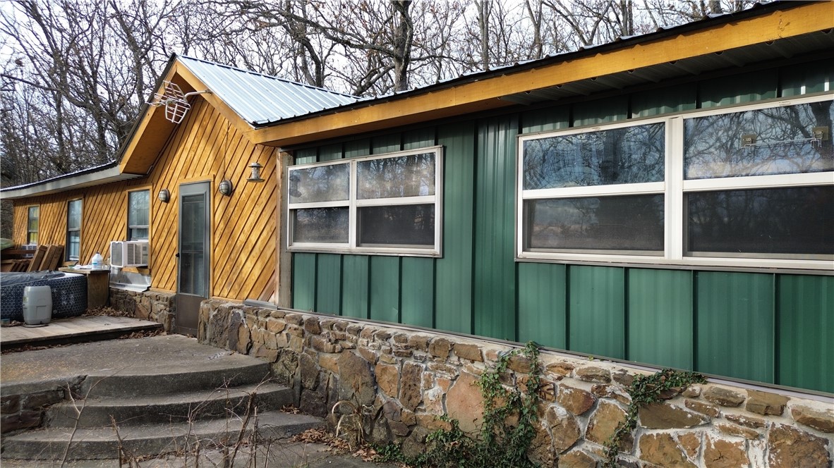 Diamond in the Rough! Excellent location for a family seeking privacy. Home is surrounded by woods with no neighbors in site from the house. 5 minutes from the Fayetteville square!