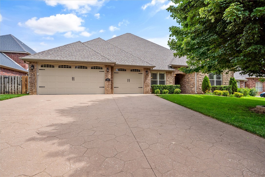 Welcome to this spacious and well-appointed home in the highly desirable Quailridge subdivision. Offering 5 bedrooms, 3 bathrooms, and 3,320 square feet, this home provides a functional layout ideal for a variety of living needs. Built in 2006 and situated on a 0.27-acre lot, the home features a desirable split floor plan, including a true in-law suite—perfect for guests or multi-generational living. The expansive primary suite offers a retreat with generous space and comfort. New roof installed in 2023. Refrigerator, washer/dryer, smart thermostats, and ring doorbell camera to convey. The main living area includes custom built-ins and flows seamlessly into the kitchen and dining spaces, creating an inviting environment for both everyday living and entertaining. Residents of this community enjoy access to neighborhood amenities including two parks, a clubhouse, and a community pool. Conveniently located within the Bentonville School District and just minutes from shopping, dining, and local attractions.