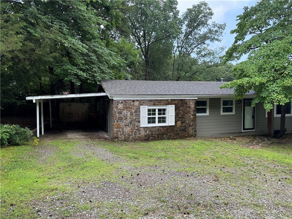 Originally built in 1956 this cute cottage in West Fork sits on a .35 acre lot and is ready for new owners.  Updates include: new kitchen cabinets, new interior paint, new granite countertops, updated lighting, added canned lights in kitchen, new backsplash, new tile flooring, new sinks, stainless appliances added and refinished hardwood flooring.  Neutral paint colors, old world charm and lots of natural light/windows.  This property features two sunrooms-one is off primary bedroom and one was used as a second living room.