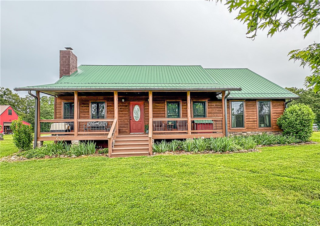 Discover your own slice of paradise with this stunning 50-acre m/l property, perfectly blending rural charm with modern comforts.  Nestled just under 5 miles from town, you can enjoy the best of both worlds-the serenity of rural life and the convenience of nearby amenities.
With 50 acres of lush land, this property is ideal for farming, gardening, or recreational activities.  The property is fully fenced and cross-fenced, has a pond, a freeze proof cattle waterer and corral and year-round spring.  The 40x50 barn and additional workshop are perfect for the hobbyist or farmer.  
The charming 3-bedroom, 2-bathroom home boasts a warm, welcoming atmosphere with pine floors, doors and trim to enhance the rustic charm.  Also included are walk-in closet, energy efficient windows, and a whole-house generator.