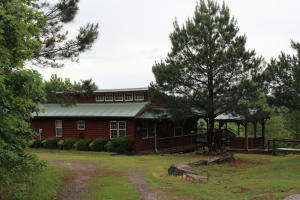 YOU'RE ON THE ROAD TO RECOVERY as you drive into your new ALL SEASON RETREAT! This 3 bedroom,ALL WOOD,CABIN has all the perks you'll need to get the R&R you need. Walking distance to National Forest, this home boasts a MILLION DOLLAR VIEW, wraparound covered porch,hot tub, fire-pit, all on 5 Breathtaking acres. Inside, you'll appreciate the quality wood craftsmanship on the walls, ceilings, and floors. Focus on the stone gas burning fireplace then draw your attention to the open living room,dining area and kitchen. Step out of your bedroom onto the covered deck to see a fabulous breathtaking view. Enjoy the hot tub while watching the fire in your fire-pit,head to the woods for a hike, or travel across the field to fish in the neighbor's pond(deeded easement included.Year-round living!