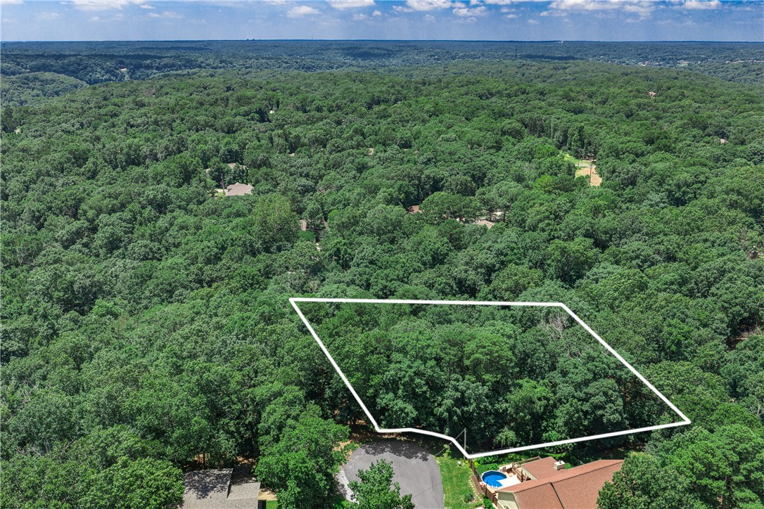Beautiful 0.38-acre lot located just 260 feet from Flo Ride. Surrounded by mature trees and natural beauty, this wooded parcel offers added privacy and potential. Close to all of Bella Vista’s amenities, it’s the perfect opportunity to expand and enjoy additional green space. Available for purchase with the 2 St. Neots Lane MLS 1353858 or separately. Home must sell prior to this lot selling or at the same time.
