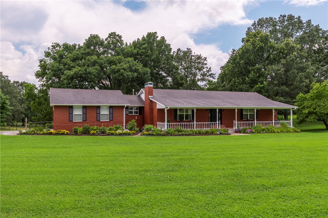 2814 sq ft home, 960 sq ft Barn, 480 sq ft Barn, 1344 Shop with garage doors, 720
sq ft RV Carport. Home is in immaculate condition. 12.43 acres of beautiful pasture land, 450 ft.frontage on W. Wedington, can be zoned commercial. Hardwood floors, 3 bed, 2 1/2 baths, office or game room, dining room, eat in kitchen, large family room. A chef's kitchen, perfect lay out. Granite counter tops, Refrigerator, Washer and Dryer new, all convey with the home. Screened in outside patio. Storage room off the back of the home. This home is a rare find. Don't Miss Out.  This property could be a commercial property. Other businesses in the area.