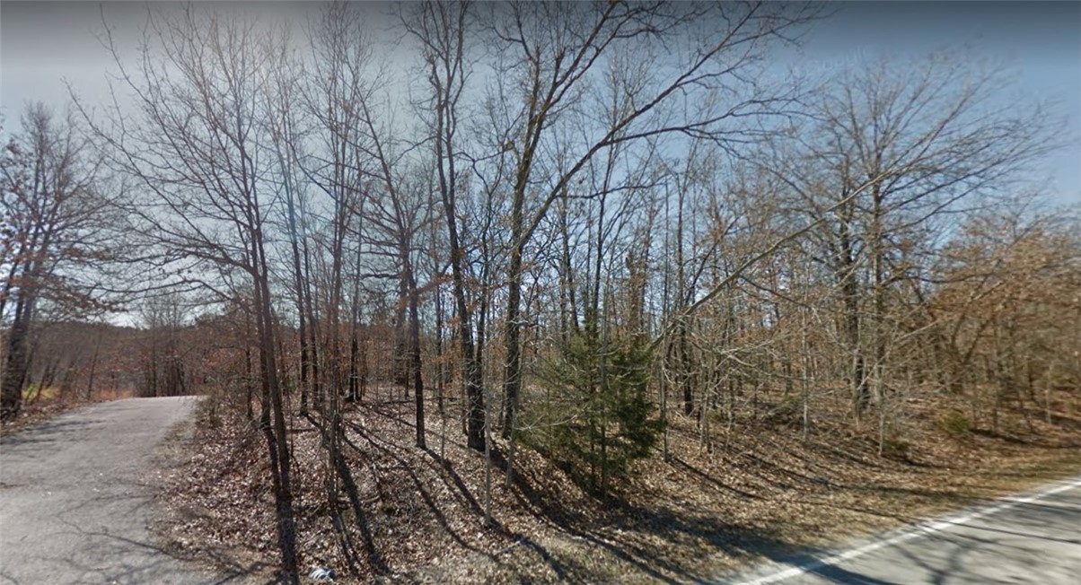 Residential vacant lot between Highlands and Scottsdale Golf Courses. Short distance to Jane, Mo Walmart, Branchwood Rec. Center, parks and Loch Lomond.  Corner lot in quiet neighborhood.