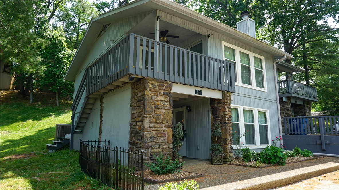 Discover this wonderful retreat in the woods at 68 Dogwood Dr. Being located less than 5 minutes from 71N, This property offers a seamless blend of comfort and convenience. 3 bedrooms/ 2 bath total. 1 bedroom, a cozy kitchen, dining, living area and a covered porch complete the first floor, 2 bedrooms, 1 bath, a dedicated laundry room, living area, and a upper deck with sweeping views of the area fill out the second story. This condominium offers a great opportunity to embrace the Bella Vista lifestyle. The adjoining unit at 66 Dogwood (MLS# 1352949) is also for sale so there is an option of having the entire building via 2 separate sales.