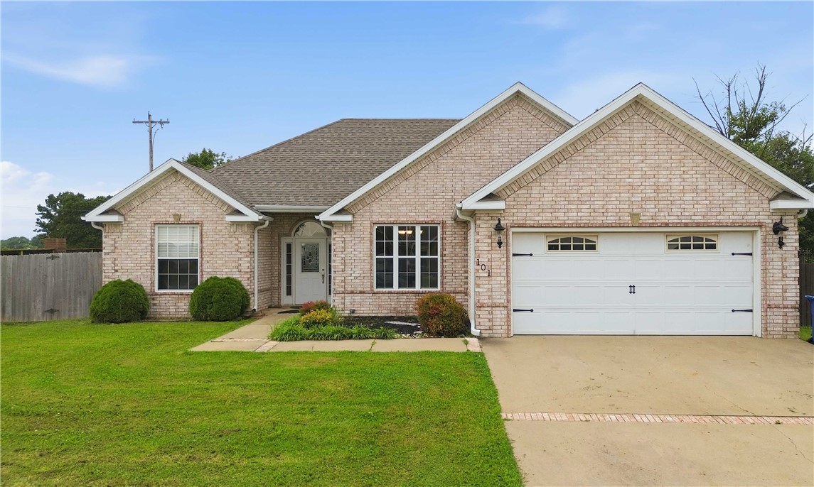 Welcome home to this well-maintained 3-bedroom, 2-bath split floor plan offering comfort, functionality, and extra space to enjoy. The inviting living room features a cozy fireplace, creating the perfect gathering spot for family and friends. The galley-style kitchen provides an efficient workspace and adjoins a bright breakfast nook for casual dining. Step outside to a fully fenced backyard complete with a unique catio on the covered patio, giving your feline friends a safe outdoor retreat. Need extra space for hobbies or a home office? The detached 12x16 insulated building with electricity offers endless possibilities as a she shed, workshop, studio, or flex space. With attractive brick-front curb appeal and a layout designed for everyday living, this home is ready for its next owner.