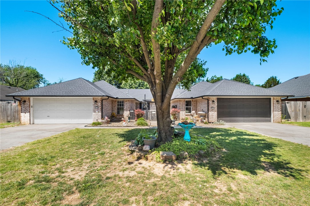 True Side-by-Side Duplex updated. Perfect for owner occupy one side + rent the other, multi-generational living or pure investment. Separately metered utilities. Enter through a private gate to a beautiful, landscaped courtyard, concrete walkway covered by a pergola.  Approximately 15 minutes to Bentonville Walmart Campus. Close to Schools, trails and shopping. Fantastic location! 3 bedroom 2 full baths on each side. Designed for dual living with complete independence. Recent updates on both units include new roof, gutters, interior paint, bathroom faucets, high rise toilets, new back doors, screened security front doors, added insulation in attic, new exterior and interior lighting fixtures, wood fence with double extended gates, and flooring. Unit A as of 2025 has a new furnace, full length patio with patio cover and bar, new garage door opener with springs. Unit B has newly installed High efficiency double pane vinyl windows, walk-in-shower with step in bathtub ($12,000), patio and patio cover and garage door.