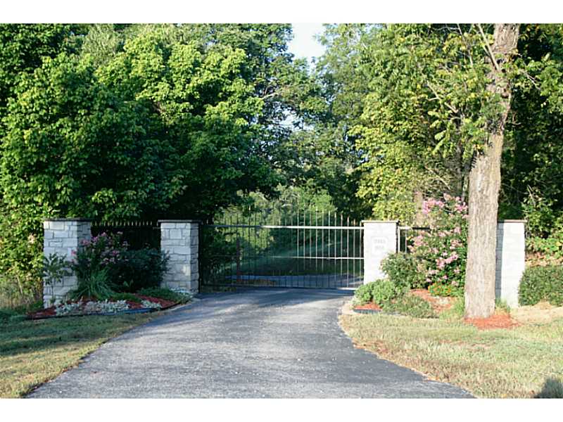 Views, land, ponds, springs, barns, workshed, and house. This property is beautiful. Drive in to open your pretty gate, drive to your house over a bridge that passes over Keel's Creek. Granite countertops, Cathedral ceilings,  limestone hearth,Garden Spot with sprinkler system, Master accesses deck with hot tub.