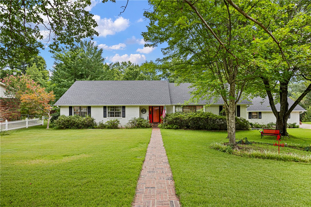 Welcome to this beautiful 3-bedroom, 2.5-bath home offering approximately 2,598 square feet of living space on a well-maintained 0.4-acre lot in Russellville. Built in 1977, this spacious home offers plenty of room to live, entertain, and make it your own. Recent updates include a roof, aluminum siding, and carpet, all approximately 2 years old. Outside, you’ll find a private, fenced backyard and an irrigation system that helps maintain the property’s incredible landscaping. With mature trees, beautiful flowers, and a meticulously cared-for yard, this property offers one of the most picturesque outdoor settings you’ll find. Located on Kings Court, this home combines timeless charm, valuable updates, and exceptional outdoor spaces. Schedule your showing today to see all this beautiful property has to offer!