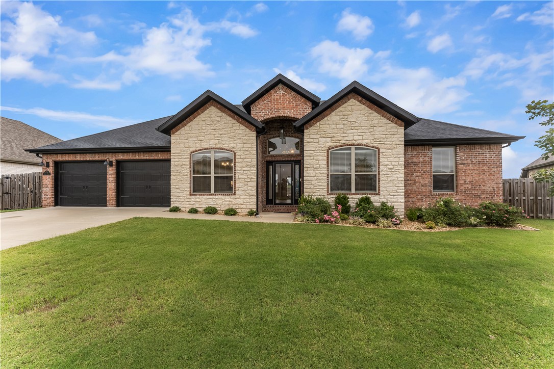 Welcome to 1770 Sunrise Circle. . . a meticulously cared for brick & stone 4-bed, 2-bath, split floor plan
home located on a large level lot in a quiet subdivision. Walking distance to Centerton Gamble Elementary
& 1 mile to Bentonville West High School. The kitchen features granite counter tops, stainless steel
appliances, white cabinets, pantry & dining space overlooking the backyard. Living space is open to
the kitchen and flows perfectly for everyday living or entertaining with direct access to the patio. Dining
room is located at the front of the house with flexibility to be used as an office or a family room. Ceramic
wood-appearance tile floors flow throughout the main living space with carpet in the bedrooms. Primary
suite includes a beautiful, over-sized tiled shower, walk-in closet & dual vanity. The level backyard
features a covered patio, gas fireplace, wood privacy fence & plenty of space to customize as you wish. Convenient access to both Bentonville & Bella Vista with just 4 miles to I-49.