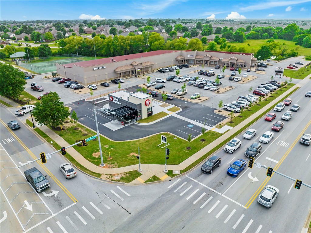 PRICED WELL-BELOW REPLACEMENT. At only $140 PSF this building can be purchased at approx. half of today's replacement cost. This price is a 6.42% Cap Rate. The rates are below market, currently about $12 PSF, modified gross. Area rents are approx. $15 Plus NNN. The upside is big here. Rare opportunity to capture a solid retail investment opportunity with over 610’ of major road frontage in one of the fastest growing market centers of the country! 100% Leased to a mix of tenants including a weightlifting gym, wrestling school, preparatory school, & a Mexican Restaurant that extended their lease during the COVID pandemic! Demand for this area is booming, there's still tenants who are trying to lease space! Situated at a hard corner on SW Regional Airport Blvd. boasting over 14,000 VPD & surrounded by over 3,100 households in a 1mi radius from the property! Great parking lot, recently completed upgrades to landscaping & the exterior! A "drink-thru" has recently signed a 5-year land lease on the NE corner of the lot.