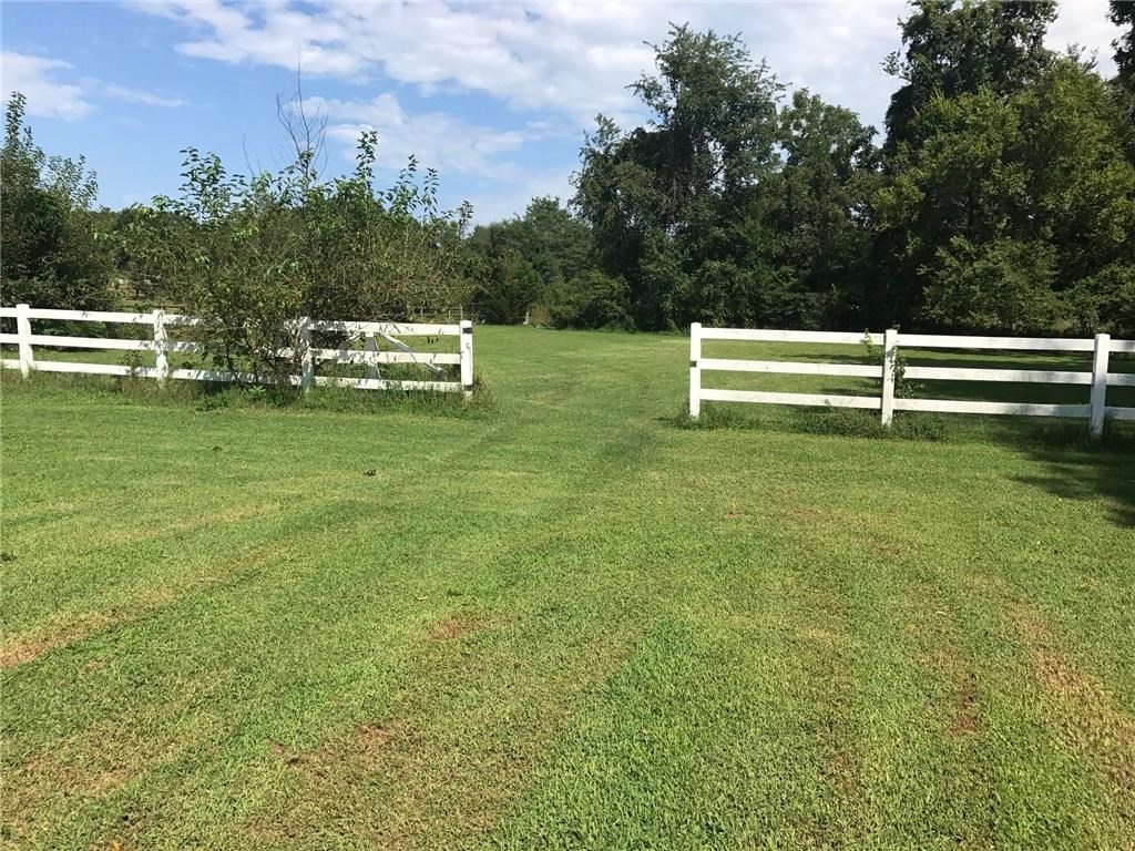 Build your dream home on 5 beautiful - level to slightly wooded acres - tucked into a gorgeous private setting at the end of the street in the center of Bentonville.  The possibilities are endless! You can't find a more convenient location. Literally just a stone's throw to WM Store #100 and Home Office. Just a few short minutes to downtown and all the amenities this community offers.  Don't wait...Bentonville real estate values are increasing. This is an incredible opportunity that won't last long.