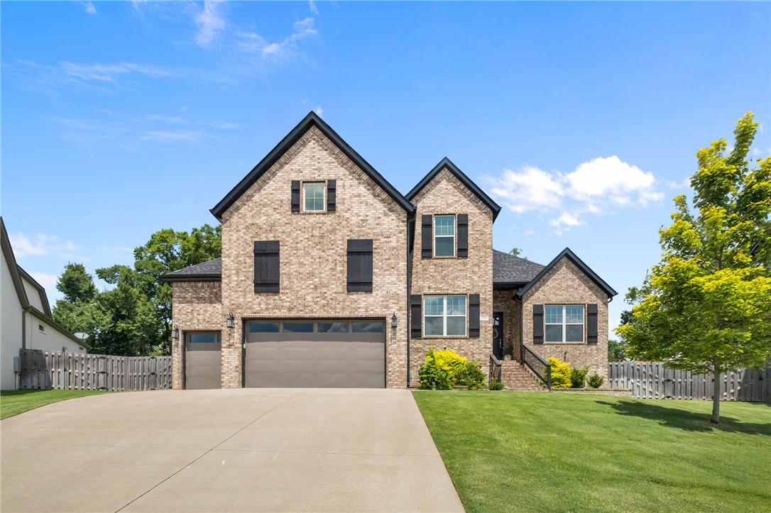 Built in 2022, this meticulously maintained home sits on nearly half an acre, one of the largest lots in Clarendon Heights. Mature trees create a private, peaceful backyard just minutes from Downtown Bentonville, with no line of sight into a neighbor's kitchen or patio.

The main level includes the primary suite, a second bedroom with adjacent full bath, and a dedicated office, living much like a one-level home. Upstairs offers two more bedrooms, a third full bath, and a bonus room. A covered patio overlooks the oversized backyard, perfect for morning coffee or entertaining.

Offering 3,150 square feet, 4 bedrooms, 3 full baths, a bonus room, an office, and a 3-car garage, this move-in-ready home has been well cared for. Minutes from the Walmart Home Office, Downtown Bentonville, Crystal Bridges, Pinnacle Hills Promenade, the Walmart AMP, and NWA's trails. Zoned for Central Park Elementary, Fulbright Junior High, and Bentonville High.

Rare to find this much privacy and space so close to Downtown Bentonville.