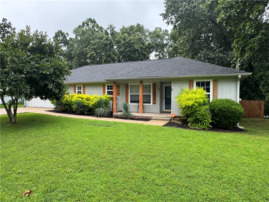 Back on the market. Prime location just a 2 minute ride to the Back 40 Bike Trail / 5 minute drive from new Bike Park / 71 business. This 1,517 sq ft, 3-bedroom, 2-bath, 2 car garage with workshop, open concept floorplan with a flex room (office) home sits on a private / spacious 0.31-acre lot. Features include a screened-in back porch, a oversized, flat, fully fenced backyard—ideal for year-round outdoor enjoyment. Built in 1997, the home offers numerous updates including a new HVAC system (2022), updated flooring (2025), new fence (2024), remodeled primary bath (2025), updated kitchen (2019), and replaced septic tank (2025). Additional improvements include a new electrical panel (2022), microwave (2022), and dishwasher (2026). Roof has been replace. Showings appointments available beginning Friday, June 26.