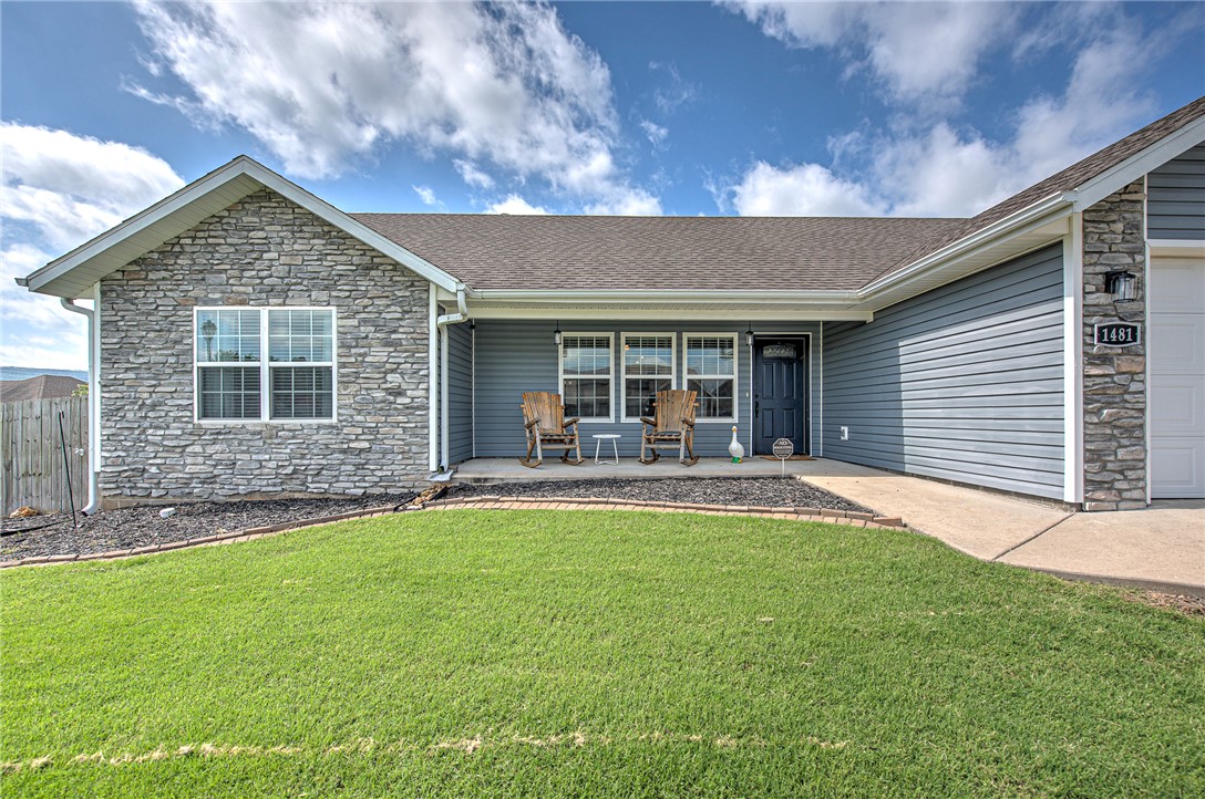 Enjoy move-in ready convenience in Prairie Grove with fresh paint, hard floors, and a spacious corner lot less than 15 minutes from the dining, shopping, and amenities of Fayetteville! This split floor plan home features a central kitchen opening directly into the living room, complete with a dedicated dining area. Bonus: hard floors throughout, zero carpet! The primary bedroom features a spacious walk-in closet, and the refrigerator, washer, and dryer can be negotiated in the sale. The exterior features ledgestone veneer accents, plus covered front and back porches. Entertaining is a breeze in the fully fenced, level backyard that takes full advantage of the corner lot to offer extra space for pets or gatherings. Fantastic location in peaceful Prairie Grove with incredibly easy access to Fayetteville and I-49!