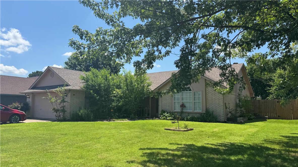 Welcome to this beautifully located 3 BR, 2 Bath home in one of Roger's most desirable subdivisions. Conveniently situated just off 1-49, schools, dining, shopping, and everything Northwest Arkansas has to offer. Step inside to a spacious entryway featuring durable laminate flooring that flows into a thoughtfully designed split-bedroom floor plan, offering both comfort and privacy.  The LR area is centered around a cozy fireplace-perfect for relaxing evenings at home.  The kitchen is equipped with stainless steel appliances and opens to a large dining area making it ideal for entertaining or for family gatherings.   Sunroom provides the perfect spot to enjoy your morning coffee while overlooking a fully privacy fenced backyard, great for kids, pets, or grilling on the patio. With its functional layout, desirable features, and unbeatable location, this home is a fantastic opportunity you won't want to miss.