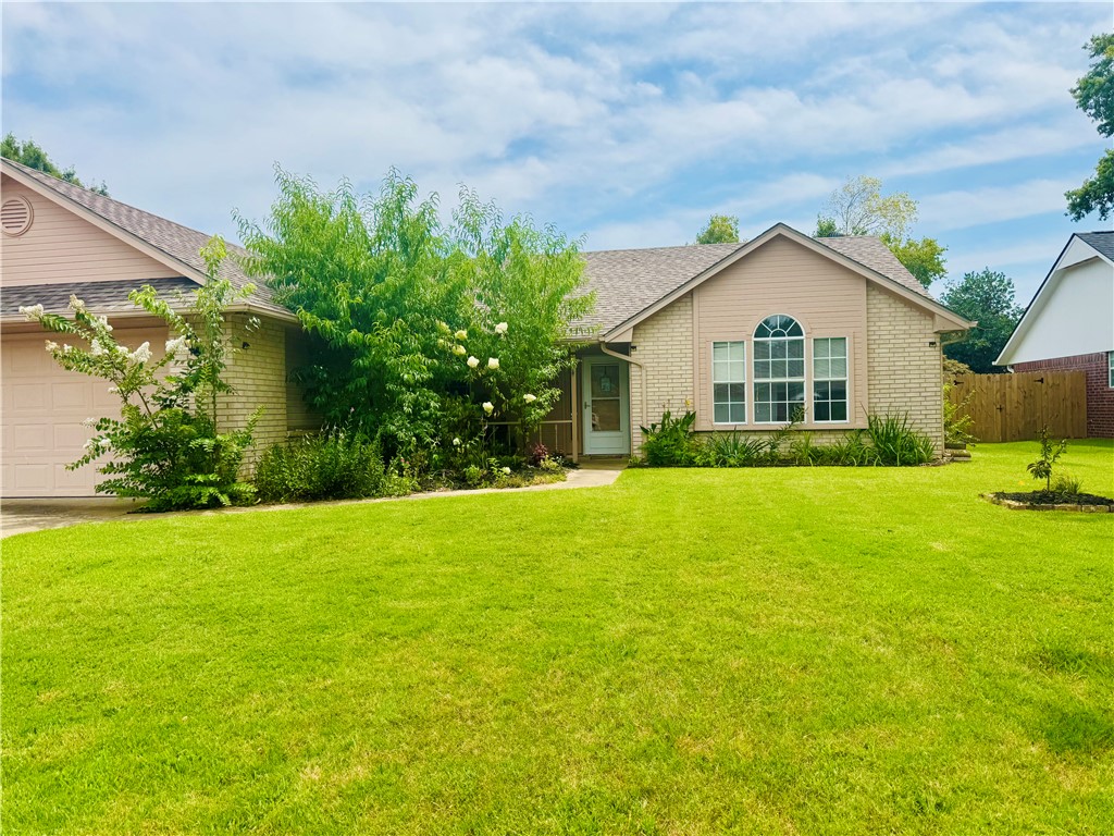 Welcome to this beautifully located 3 BR, 2 Bath home in one of Roger's most desirable subdivisions. Conveniently situated just off 1-49, schools, dining, shopping, and everything Northwest Arkansas has to offer. Step inside to a spacious entryway featuring durable laminate flooring that flows into a thoughtfully designed split-bedroom floor plan, offering both comfort and privacy.  The LR area is centered around a cozy fireplace-perfect for relaxing evenings at home.  The kitchen is equipped with stainless steel appliances and opens to a large dining area making it ideal for entertaining or for family gatherings.   Sunroom provides the perfect spot to enjoy your morning coffee while overlooking a fully privacy fenced backyard, great for kids, pets, or grilling on the patio. With its functional layout, desirable features, and unbeatable location, this home is a fantastic opportunity you won't want to miss.