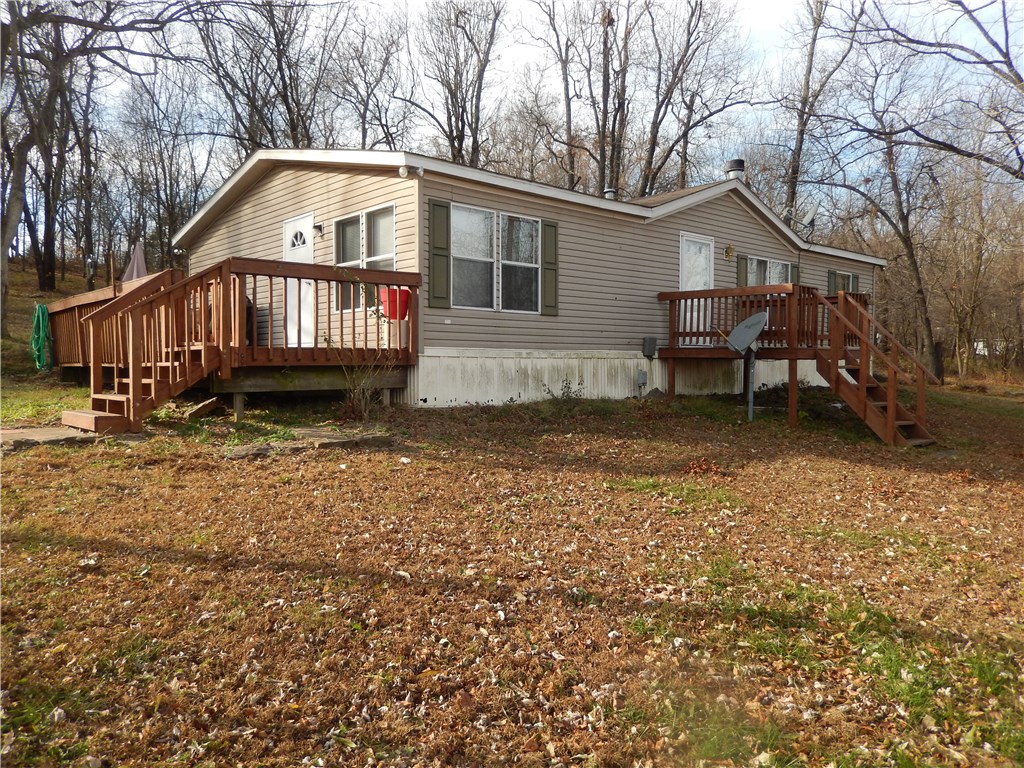 Peace and quiet! Lots of wildlife! On 2.61 acres! Beautiful views! Very nice double wide on permanent foundation. Cozy wood burning fireplace in living room, and gourmet eat-in kitchen. 3 bedrooms 2 baths, above ground pool, and garage. A Must See!