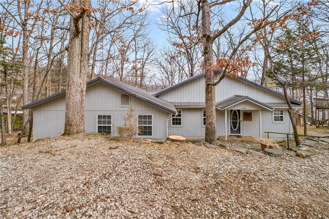 Enjoy seasonal lake views of Beaver Lake from this inviting 3-bedroom, 3-bath home, perfectly suited for full-time living or a relaxing getaway. The interior features stunning vaulted wood ceilings that create a warm, open feel, along with an updated kitchen designed for both style and functionality. Step outside to over 600 sq ft of covered deck space, ideal for entertaining, dining, or simply taking in the serene surroundings year-round.

Located in a desirable community, residents enjoy amenities including a swimming pool, pickleball courts, and the convenience of being just a short distance to lake access for boating, fishing, and recreation. This property combines natural beauty, comfort, and lifestyle in one exceptional package.  This would make an ideal vacation rental and they are allowable in Lost Bridge Village.  Furnishings convey with purchase!