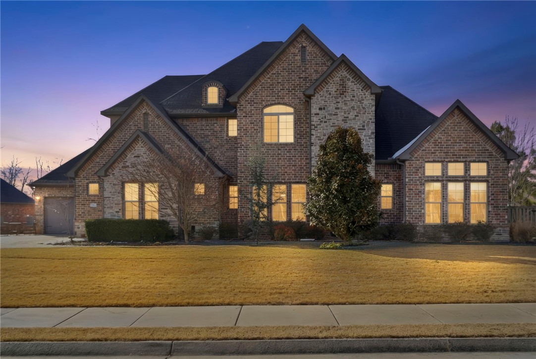 Stunner in Oak Tree's Enclave, one of Northwest Arkansas' premier gated communities. This home has it all! Home office, media room, bonus room with wet bar, butler pantry, storm shelter, and the list goes on and on.This gorgeous home sits on a beautiful .62-acre corner lot, providing exceptional privacy, mature landscaping, and abundant natural light throughout the day. With spacious grounds and a prime position, it feels like your own private retreat while enjoying all the benefits of gated community living.Whether you're relaxing by the pool, playing a friendly tennis match, or gathering with neighbors in the clubhouse, this neighborhood fosters connection and enjoyment for all ages.