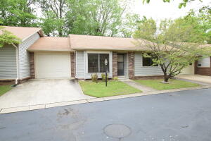 Well maintained condo - 2 Bedroom, 1 1/2 Bath, 1 car attached garage, covered patio, fenced back yard, Newly update paint throughout.   It has a large fenced back yard that backs up to a wooded area. Closed in sunroom (not heated) and outdoor patio. Single car garage.  Refrigerator and washer/dryer convey.  It has a walk-in tub/shower combo for limited mobility owner's convenience.