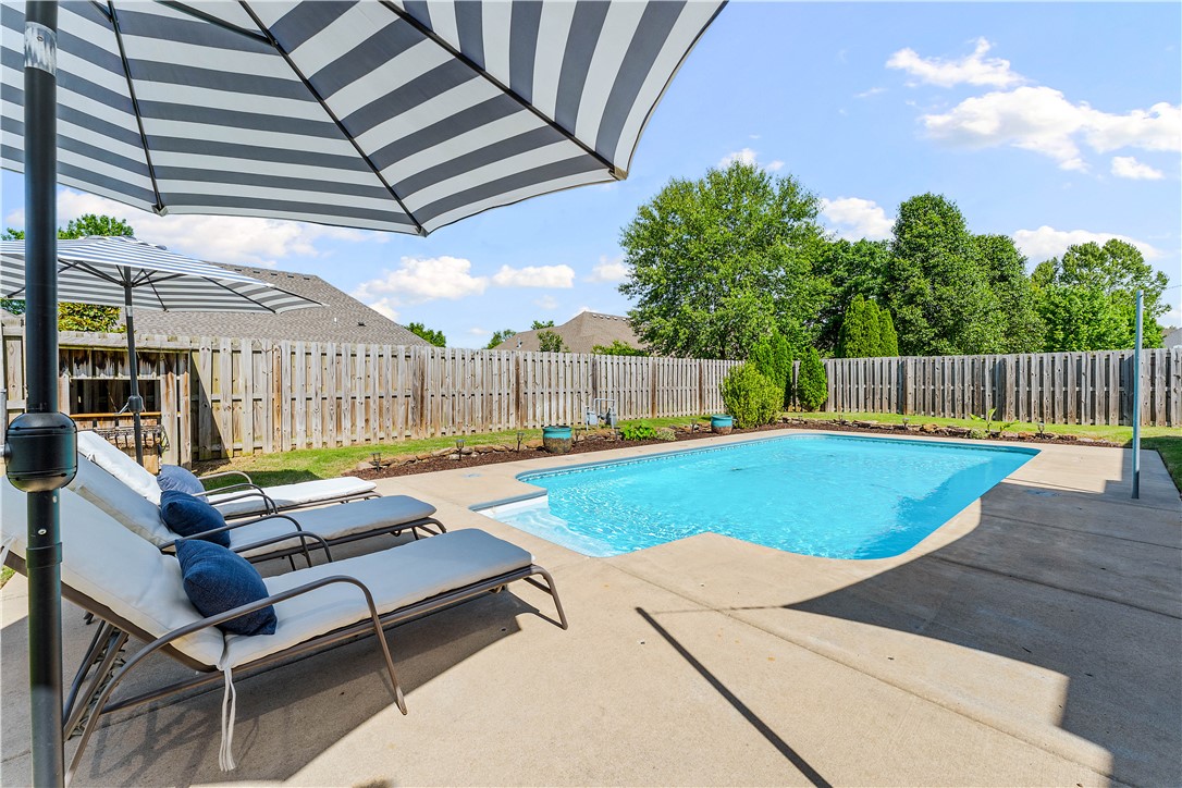 Stunning, meticulously maintained 2,620 sq ft all-brick home in the highly sought-after Belclaire Estates, offering 4 bedrooms, 2.5 baths, and a spacious bonus room. This exceptional property features elegant custom woodwork and cabinetry, 3cm granite countertops, Low-E windows, and a built-in sound system throughout. Enjoy the warmth of two fireplaces, including one in the inviting living room and another in the luxurious primary suite. The open-concept layout is perfect for entertaining, flowing seamlessly to a large covered patio. Step outside to your private backyard oasis with professional landscaping and a heated in-ground saltwater pool, ideal for relaxing or hosting gatherings year-round. Additional highlights include a 3-car garage, oversized walk-in pantry, sprinkler system, central vacuum, and convenient access to Highway 49 for an easy commute. A perfect blend of luxury, comfort, and everyday convenience in a premier location.