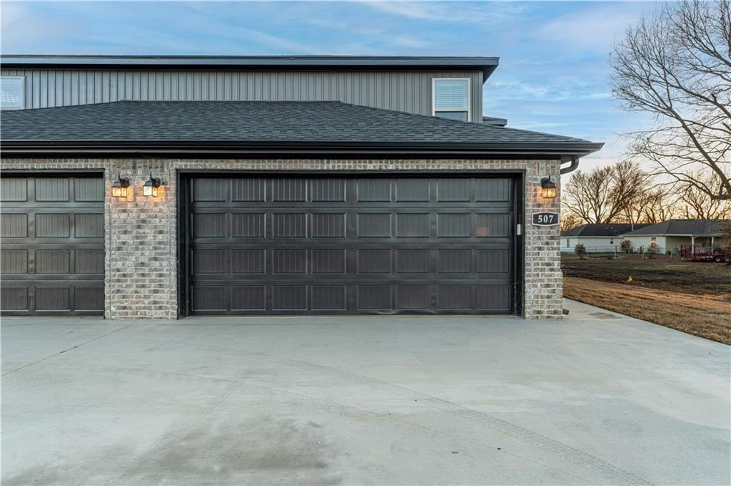 Quality 2024-built fully-furnished townhome located in the heart of Gentry, offering the perfect blend of comfort, style, and convenience. The spacious floor plan features a welcoming living room with a beautiful fireplace, creating a warm and inviting atmosphere. The open-concept kitchen and living area are ideal for entertaining guests or spending quality time with family while preparing meals. A large window above the kitchen sink fills the space with natural light. Upstairs, you'll find three generously sized bedrooms and two full bathrooms. The primary suite features a spacious en-suite bathroom and a large walk-in closet, providing both comfort and functionality. Conveniently located just minutes from Gentry schools and adjacent to the new ballfields, this townhome offers an exceptional location with easy access to local amenities and recreation.