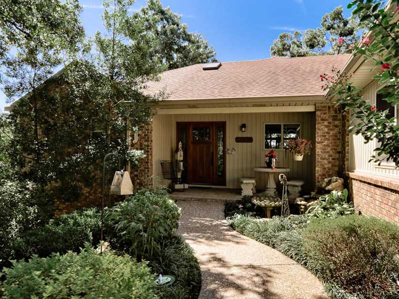 Open floor plan, 3 bedroom, 2 bath, 1687 sq ft, beautiful attention to detail. Vented gas fireplace, custom built-ins by Nightengale, wood floors, heated tile master bath floor, wired for sound, beautiful flagstone steps to paver patio, paved path to dock,& 130' of Lake Brittany shoreline.  Beautifully landscaped, shows like new inside and out. 505  sq ft of partially finished, heated and cooled space on lower level through outside entrance, nic in sq ft.  Propane tank conveys.