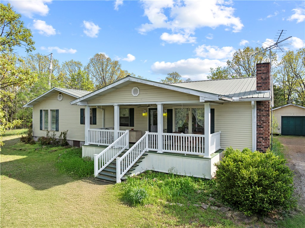 Welcome home to your own private slice of the Ozarks! Nestled on 8.07 acres, this inviting 4-bedroom, 2-bathroom property offers the perfect blend of comfort, privacy, and room to breathe.  The spacious home offers comfortable living for family and friends, while the acreage gives you endless opportunities for gardening, recreation, or simply enjoying the beauty of the outdoors.  A standout feature of this property is the impressive 40' x 50' shop, offering abundant space for hobbies, equipment, vehicles, storage, or your next big project. You'll also appreciate the convenience of a detached garage, providing additional storage and workspace options.
The home is being offered partially furnished, making your move even easier. All appliances convey, including two refrigerators, washer, dryer, stove, and microwave.
Located just minutes from Bull Shoals Lake, you'll enjoy easy access to boating, fishing, and all the outdoor adventures the Ozarks have to offer.