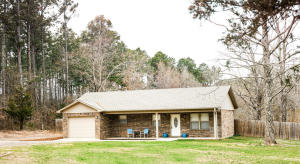 Welcome home! This lovely home is located in the heart of Dover and only a short drive to town. You will love the attention to detail, the open floor plan, fresh paint and updated fixtures.  The large backyard is over half an acre and is fully fenced with a storm shelter.