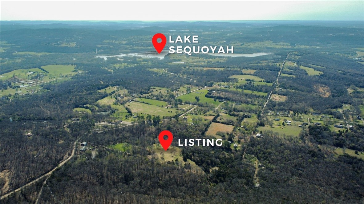 Beautiful 6.3 acre parcel perfect for your dream home, close to Lake Sequoyah, minutes to downtown Fayetteville and the University. Partially wooded with plenty of flat spots to build. There is even a beautiful creek on the property. Water tap paid for, perc test available. No mobiles allowed. 2,000 SF min home allowed.
