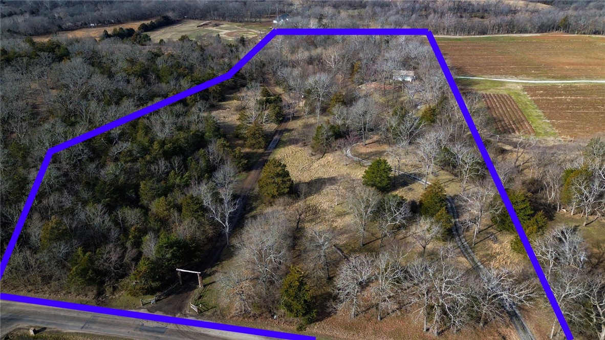 Welcome to 3237 Dead Horse Mountain Road, a remarkable property nestled in Fayetteville, Arkansas. This exclusive listing offers a truly exceptional opportunity to build your dream home on expansive acreage, all while enjoying the serene rural ambiance of the land, which is conveniently located just 15 minutes away from the bustling University of Arkansas and the vibrant Fayetteville downtown square. In addition to its closeness to the university, this property also boasts its proximity to the renowned Stonebridge Golf Course. Ranked as the #5 golf course in Arkansas by Golf Advisor in 2020. Enjoy the peaceful countryside while still having easy access to everything the city has to offer. Experience the best of both worlds without sacrificing modern conveniences. Furthermore, this property offers tremendous development potential. Whether you envision constructing your own private estate or exploring the possibility of subdividing the land, the options are endless.