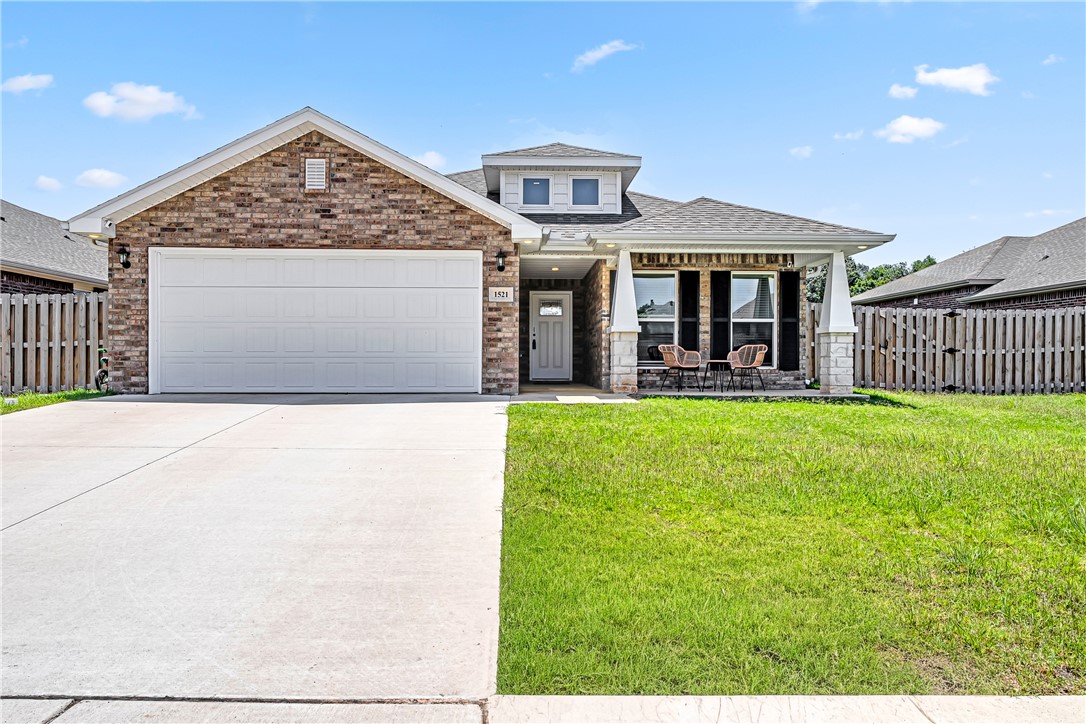 If you've been searching for a new construction home without the wait, your search ends here! This stunning 2023-built home is move-in ready and checking every box. With 3 bedrooms, 2 bathrooms, and 1,859 square feet of beautifully designed single-level living, this home feels brand new because it practically is! The open layout features granite countertops, LED lighting, walk-in closets, and a cozy electric fireplace — all the finishes you'd pick if building from scratch. The kitchen is a dream with a gas range, built-in microwave, and a pantry, while the covered patio out back is perfect for morning coffee or evening gatherings. The brick and Masonite exterior and 2-car garage give you that polished, put-together look from the moment you pull up. And the location? Unbeatable. You're just minutes from Bentonville High School, the Walmart Home Office, and everything the NW Arkansas corridor has to offer. Skip the construction timeline and the uncertainty — this home is ready when you are. Come see it today!
