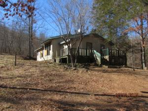 Enjoy this 26 acre private setting with stream and paved road frontage, make it your week-end get-away or home! Small 2nd floor area has 3 small rooms not included in total sq.ft. Home in need of maintenance and repairs, be sure loan type will work for condition. Rural water available. Septic and actual age is unknown, sq ftg, lot size, acreage, etc, are from public records, Buyer should verify.