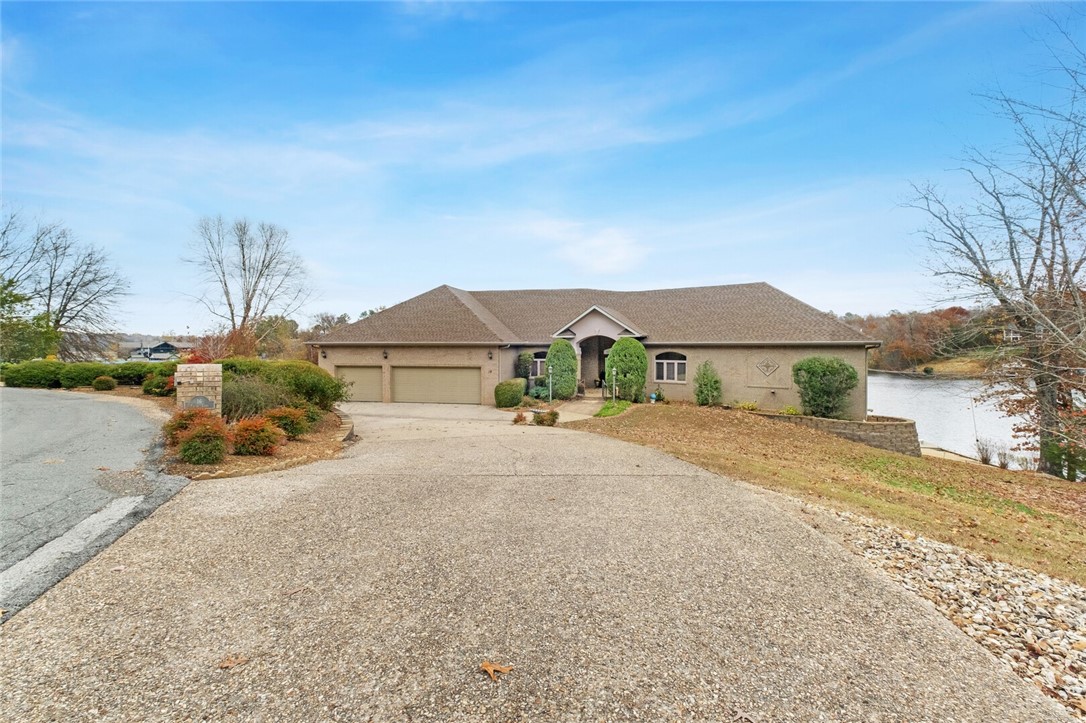 1st time offered. Perfect lake retreat. Additional 624 sq ft of unfinished room in Basement, and Cart Garage/shop has HVAC on lower level. Beautiful cabinetry throughout, Large Cedar Closet, and massive his & her closets in Master Bedroom. 4th of July fireworks from Loch Lomond dam view from Deck. Must see to appreciate.
Living Room has power sun screens. 500 Gallon buried Propane Tank, new roof October 2021