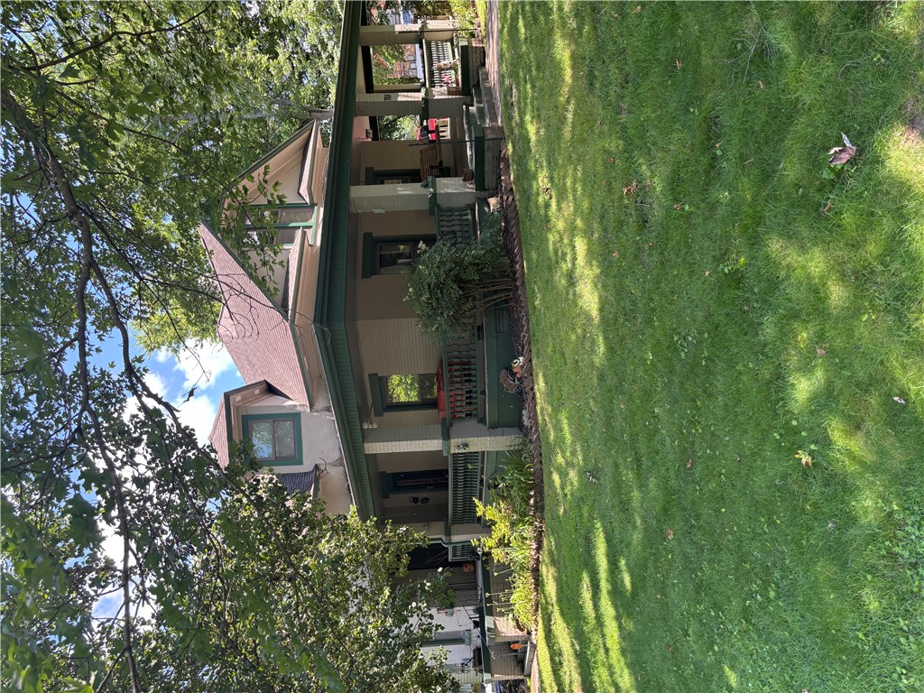 The home blends historic architecture with modern updates, including updated windows, dual HVAC/AC units, and a water softener system, and is located near downtown Harrison, schools, and parks. This 4-bedroom, 2.5-bathroom property features a wraparound covered porch and a large deck for outdoor living and entertaining. Originally built in 1913, it retains much of its vintage charm while offering updated systems, modern conveniences, and comfortable living spaces for today's lifestyle.